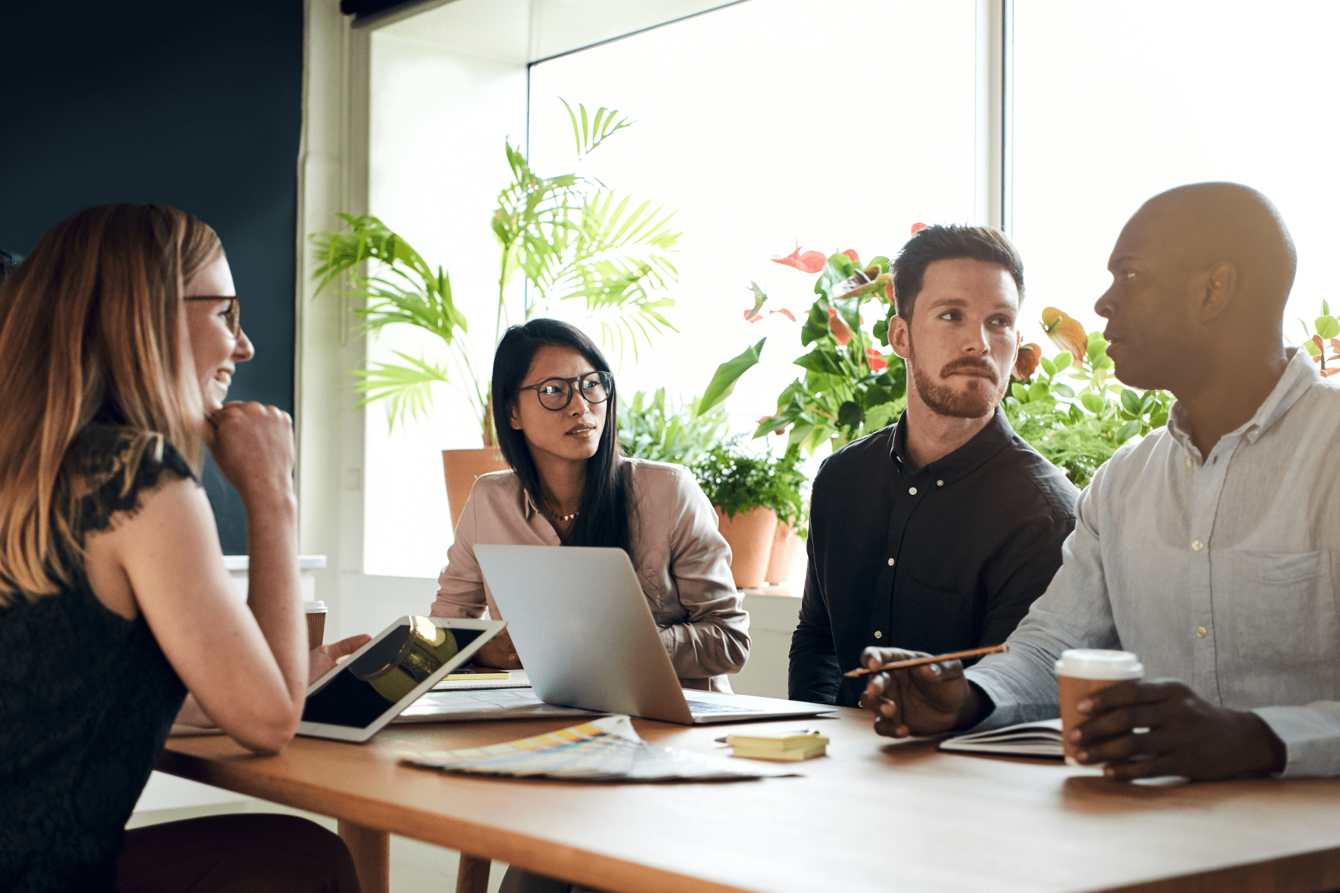 Young Smiling Business People on Meeting in Office